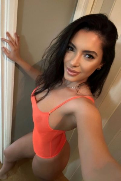 In this selfie Kylie is wearing a very sexy orange body 