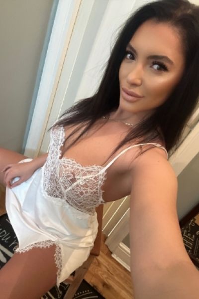 A selfie of Pune escort Kylie dressed in white lingerie 